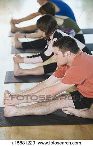 Fitness class stretching on mats View Large Photo Image Stock Photo - Fitness class stretching on mats. Fotosearch