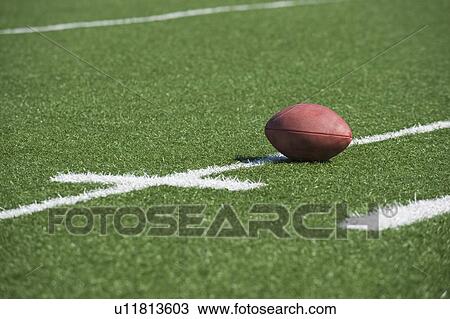 Football on yard line marker View Large Photo Image Stock Image - Football on yard line marker. Fotosearch