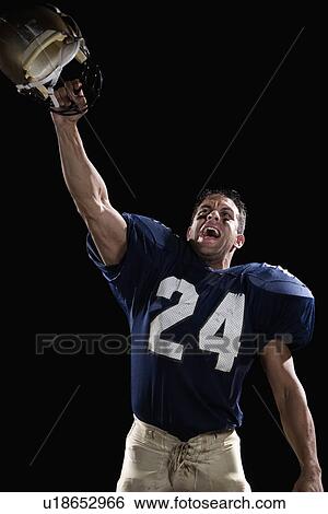Stock Photograph - Football player celebrating. Fotosearch