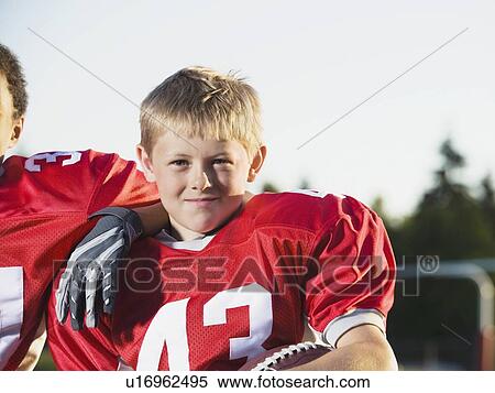 Stock Photography - Football player posing on field. Fotosearch