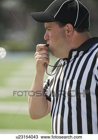 Football referee blowing whistle View Large Photo Image Stock Image - Football referee blowing whistle. Fotosearch