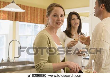 Friends at dinner party View Large Photo Image Stock Image - Friends at dinner party. Fotosearch