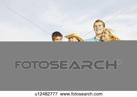 Stock Photo - Friends having fun on beach. Fotosearch