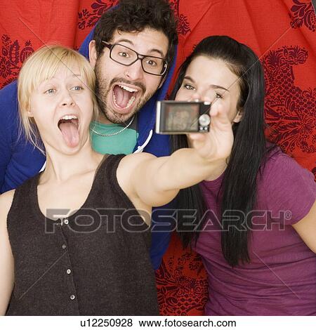 Friends taking own photograph View Large Photo Image Stock Photo - Friends taking own photograph. Fotosearch