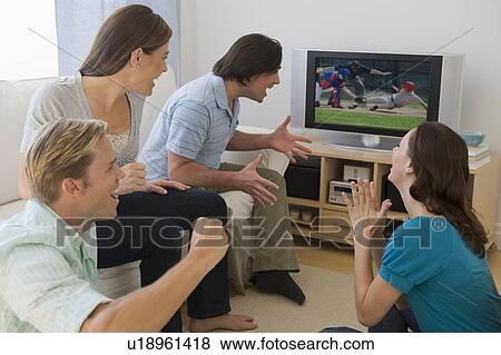 Friends watching baseball game and cheering View Large Photo Image Stock Photo - Friends watching baseball game and cheering. Fotosearch