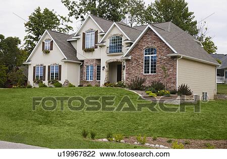 Stock Image - Front view of house. Fotosearch