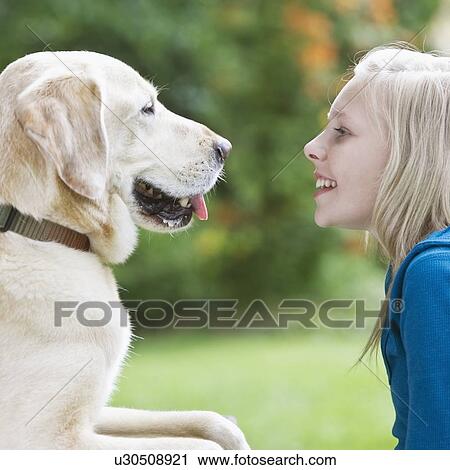 Girl and dog face to face View Large Photo Image Stock Image - Girl and dog face to face. Fotosearch