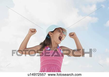 Girl at beach making funny face View Large Photo Image Stock Photo - Girl at beach making funny face. Fotosearch
