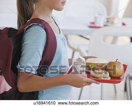 Girl carrying lunch tray at school View Large Photo Image Stock Image - Girl carrying lunch tray at school. Fotosearch