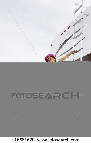 Girl climbing on motor home ladder View Large Photo Image Stock Photo - Girl climbing on motor home ladder. Fotosearch