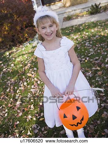 Girl dressed in princess Halloween costume View Large Photo Image Stock Image - Girl dressed in princess Halloween costume. Fotosearch