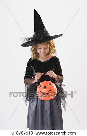 Girl dressed in witch Halloween costume View Large Photo Image Stock Photo - Girl dressed in witch Halloween costume. Fotosearch