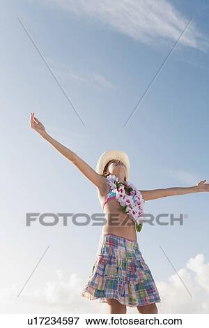 Girl in bathing suit with lei around neck View Large Photo Image Stock Photo - Girl in bathing suit with lei around neck. Fotosearch