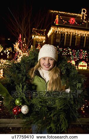 Girl in middle of Christmas wreath View Large Photo Image Stock Image - Girl in middle of Christmas wreath. Fotosearch