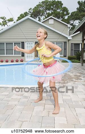 Girl in tutu hula hooping View Large Photo Image Stock Photo - Girl in tutu hula hooping. Fotosearch