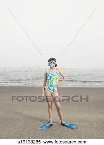 Girl on beach wearing flippers and snorkeling mask View Large Photo Image Stock Photography - Girl on beach wearing flippers and snorkeling mask. Fotosearch