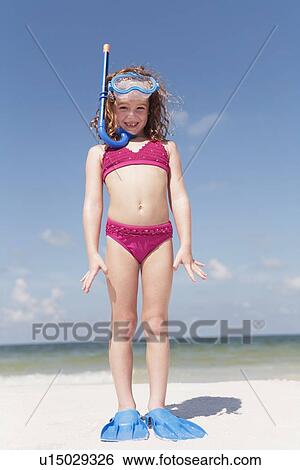 Girl on beach wearing snorkeling equipment View Large Photo Image Stock Photograph - Girl on beach wearing snorkeling equipment. Fotosearch