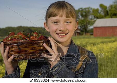 Girl picking strawberries View Large Photo Image Picture - Girl picking strawberries. Fotosearch