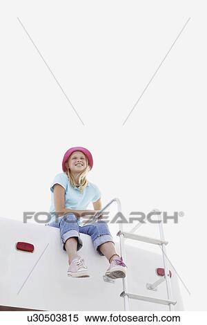 Girl sitting on top of motor home View Large Photo Image Stock Photography - Girl sitting on top of motor home. Fotosearch