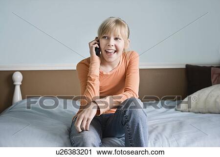Stock Image - Girl talking on cell phone. Fotosearch