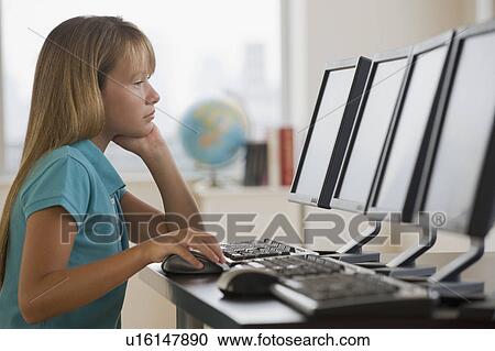 Girl using laptop in classroom View Large Photo Image Stock Image - Girl using laptop in classroom. Fotosearch