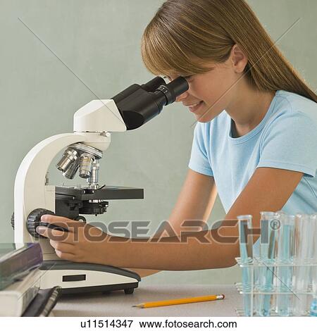 Girl using microscope View Large Photo Image Stock Photo - Girl using microscope. Fotosearch