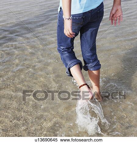 Girl wading in ocean View Large Photo Image Stock Photography - Girl wading in ocean. Fotosearch