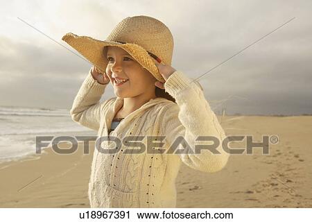 Girl wearing hat at beach View Large Photo Image Stock Image - Girl wearing hat at beach. Fotosearch
