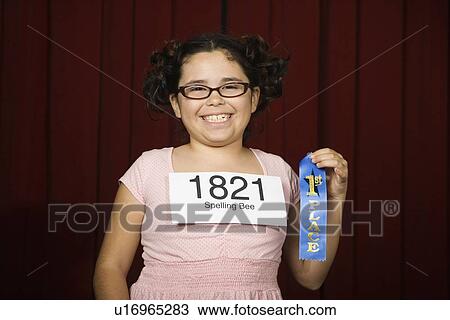 Girl wearing number and holding first place ribbon View Large Photo Image Stock Image - Girl wearing number and holding first place ribbon. Fotosearch