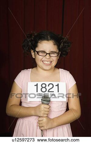 Girl wearing number on stage View Large Photo Image Stock Image - Girl wearing number on stage. Fotosearch