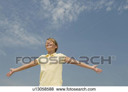 Girl with arms outstretched View Large Photo Image Stock Photo - Girl with arms outstretched. Fotosearch