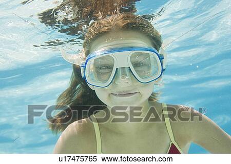 Girl with goggles swimming underwater View Large Photo Image Stock Photography - Girl with goggles swimming underwater. Fotosearch