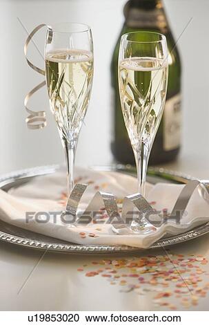 Glasses of champagne on tray View Large Photo Image Stock Image - Glasses of champagne on tray. Fotosearch