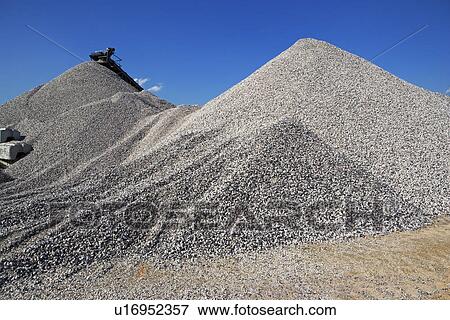 Stock Photo - Gravel mounds at concrete plant. Fotosearch