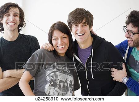 Stock Image - Group of friends laughing. Fotosearch
