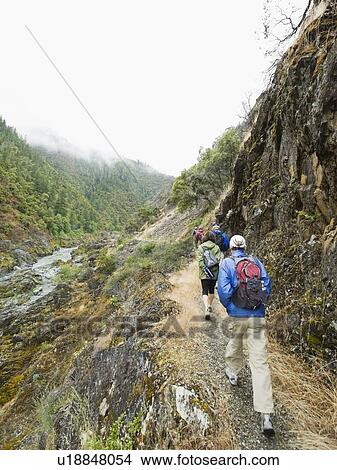 Picture - Group of hikers hiking on trail. Fotosearch