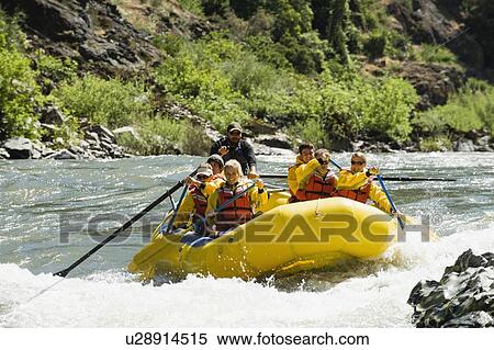 Stock Photography - Group whitewater rafting. Fotosearch