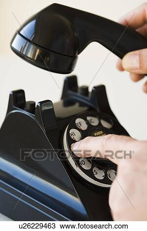 Hand dialing rotary telephone View Large Photo Image Stock Image - Hand dialing rotary telephone. Fotosearch