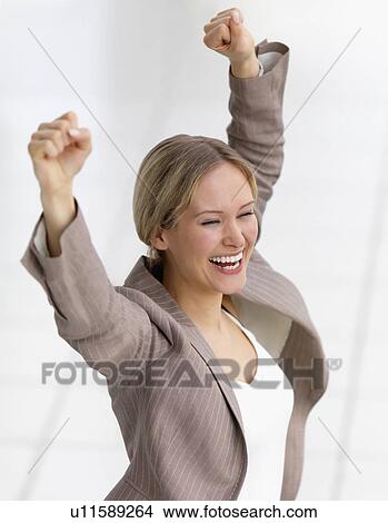 Happy businesswoman celebrating View Large Photo Image Picture - Happy businesswoman celebrating. Fotosearch