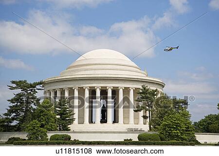 Stock Photo - Helicopter flying over Jefferson Memorial, Washington DC, United States. Fotosearch