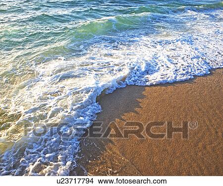Picture - High angle view of ocean waves on shore. Fotosearch