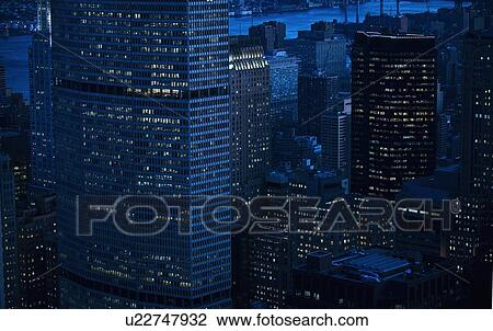 Highrise buildings in New York City at sunset View Large Photo Image Stock Image - Highrise buildings in New York City at sunset. Fotosearch