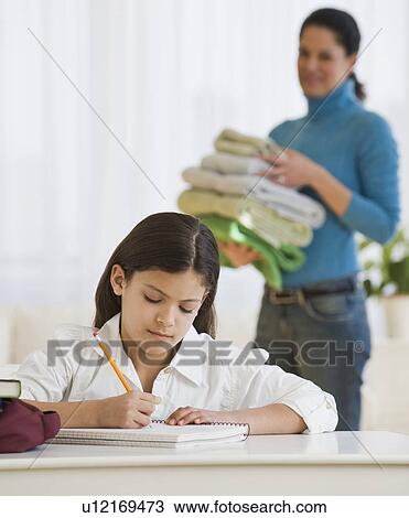 Hispanic girl doing homework View Large Photo Image Stock Image - Hispanic girl doing homework. Fotosearch