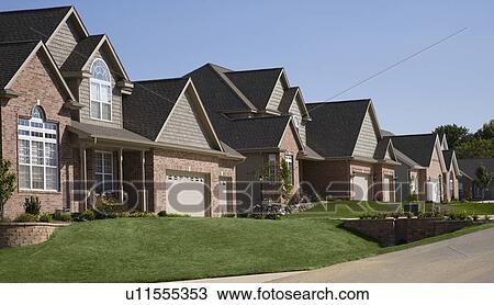 Stock Image - Houses on residential street. Fotosearch