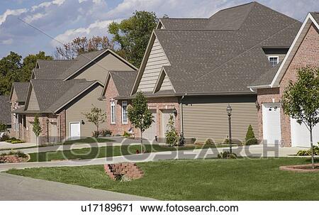 Stock Image - Houses on residential street. Fotosearch