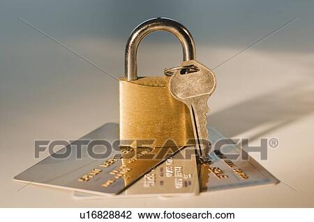 Stock Image - Lock and key on credit cards. Fotosearch