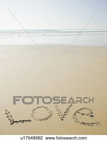 Stock Image - Love written in sand. Fotosearch