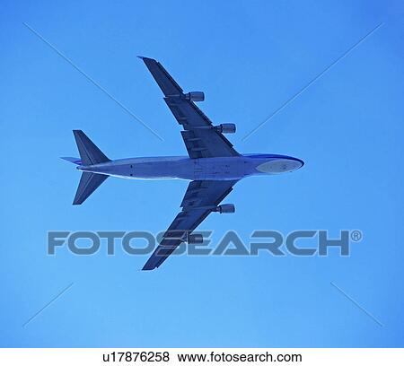 Low angle view of airplane in sky View Large Photo Image Stock Photo - Low angle view of airplane in sky. Fotosearch