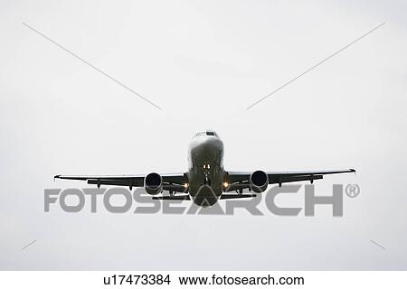 Low angle view of airplane View Large Photo Image Picture - Low angle view of airplane. Fotosearch