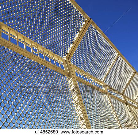 Low angle view of chain link fence View Large Photo Image Stock Image - Low angle view of chain link fence. Fotosearch